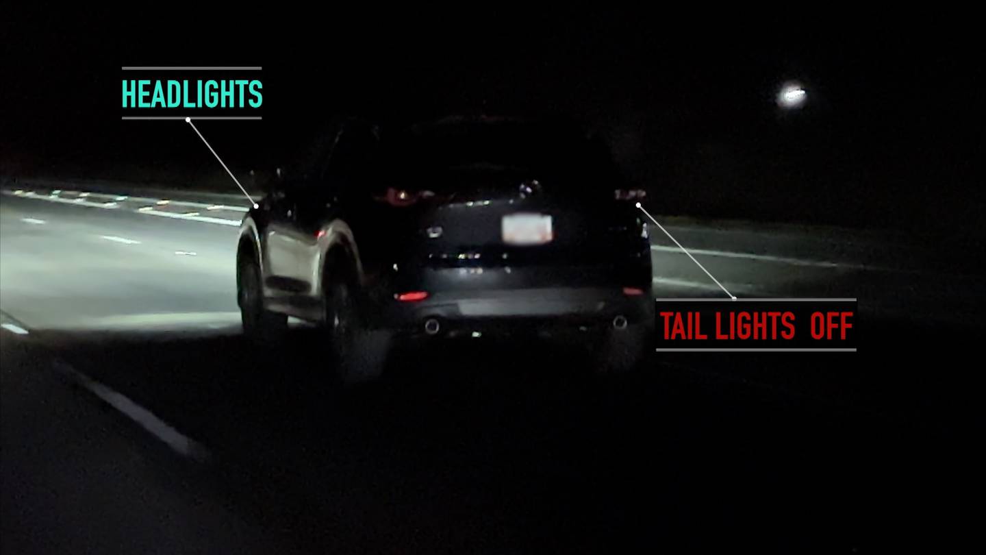 A graphic showing a vehicle driving at night. Notation highlights how it appears the headlights are on, but the taillights are not, possibly due to the car utilizing daytime running lamps.